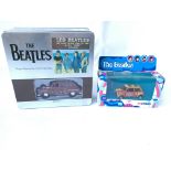 A pair of Diecast Beatles cars. Boxed.