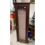 A tall glass fronted gun style cabinet. 154 x 53 x