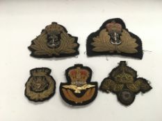 Five bullion wire military cap badges.