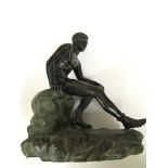 A lacquered bronze figure.