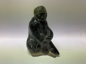 An Inuit art carved stone figure of an Eskimo fish