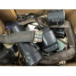 A Box Containing various cameras and lenses variou