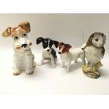 Two Sylvac dogs, one Beswick dog and a Royal Doult