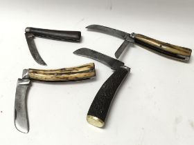 Four early vintage pocket knives, two with stag ha