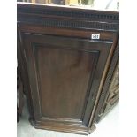 A Georgian mahogany corner cabinet with single doo