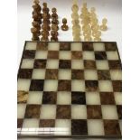A quality chess set made of amber.