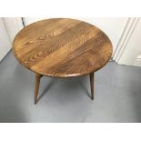 A low oak Ercole occasional table with single drop