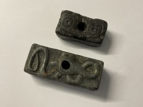 2 early carved stone (possibly Inuit art) fire sto