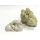 Two small jade carvings of animal figural groups.