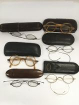 Six pairs of vintage reading glasses.