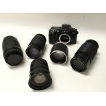 A Nikon F60 Camera and five various lenses.