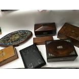 A collection of wooden boxes including a wooden ci