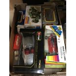 Two boxes of toys including boxed Burago Rolls Roy