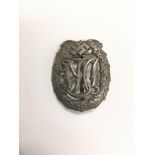 A Third Reich silver D.R.L. sports badge with orig