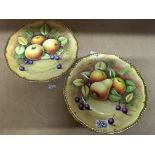 A pair of Coalport plates decorated with fruit. Si