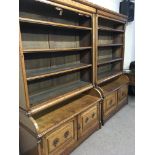 A match pair of Victorian gothic oak bookcases wit