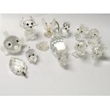 Twelve small Swarovski Crystal animals with their