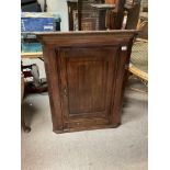 A Large oak wall mounted corner cabinet with single draw and walnut inlay.