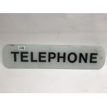 A glass inset telephone sign. Length 61cm x 14.5cm