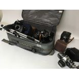 A collection of camera equipment including a DelOn