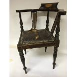 An Edwardian inlaid mahogany childâ€™s corner chai