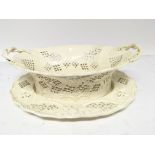 An early 19th century creamware basket and oval di