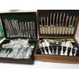 Two cased canteens of cutlery.