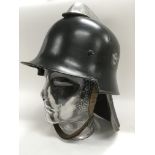 A Third Reich M34 pattern fire helmet with leather