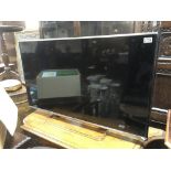 A 48" Panasonic TV, model TX47AS650B with remote c