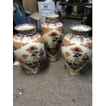 A trio of reproduction vases.