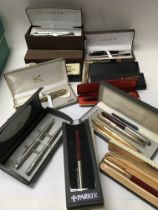 A collection of pens including a mixture of Parker