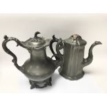 Two good early Victorian pewter lidded jugs both b