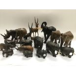 A collection of carved wooden African animals incl