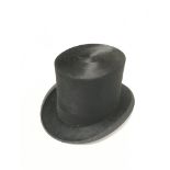 A silk black top hat made by Dunn & Co, Oxford Str