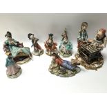 A collection of Capodimonte figures with certifica