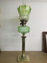A Victorian green glass Corinthian column oil lamp