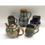 Five Royal Doulton items comprising three jugs, te