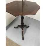 A Georgian mahogany tilt top table the shape top a