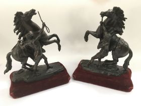 A pair of bronze Marley horses and handlers, after