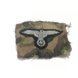 A WW2 Normandy relic. A Waffen SS sleeve eagle cut