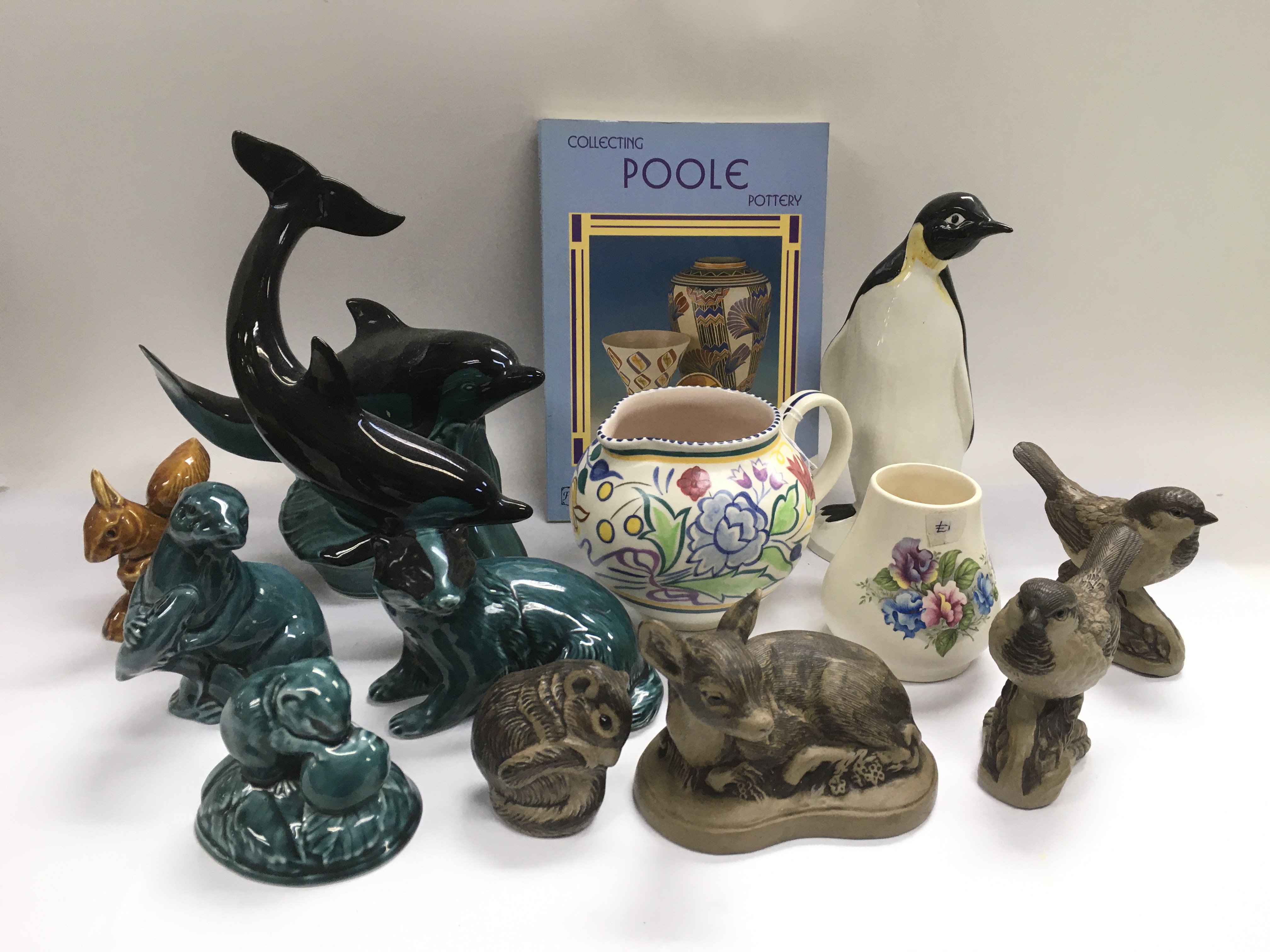 A collection of Poole pottery comprising mainly fi