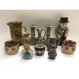 A collection of Royal Doulton items comprising a W