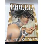 Seven collectible Pirelli calendars dating two fro