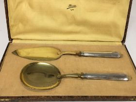 A pair of cased silver gilt French ice cream serve