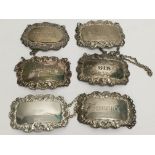 A collection of 6 silver wine labels- various hall