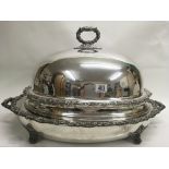 A large silver plated serving dish and cover. 70cm