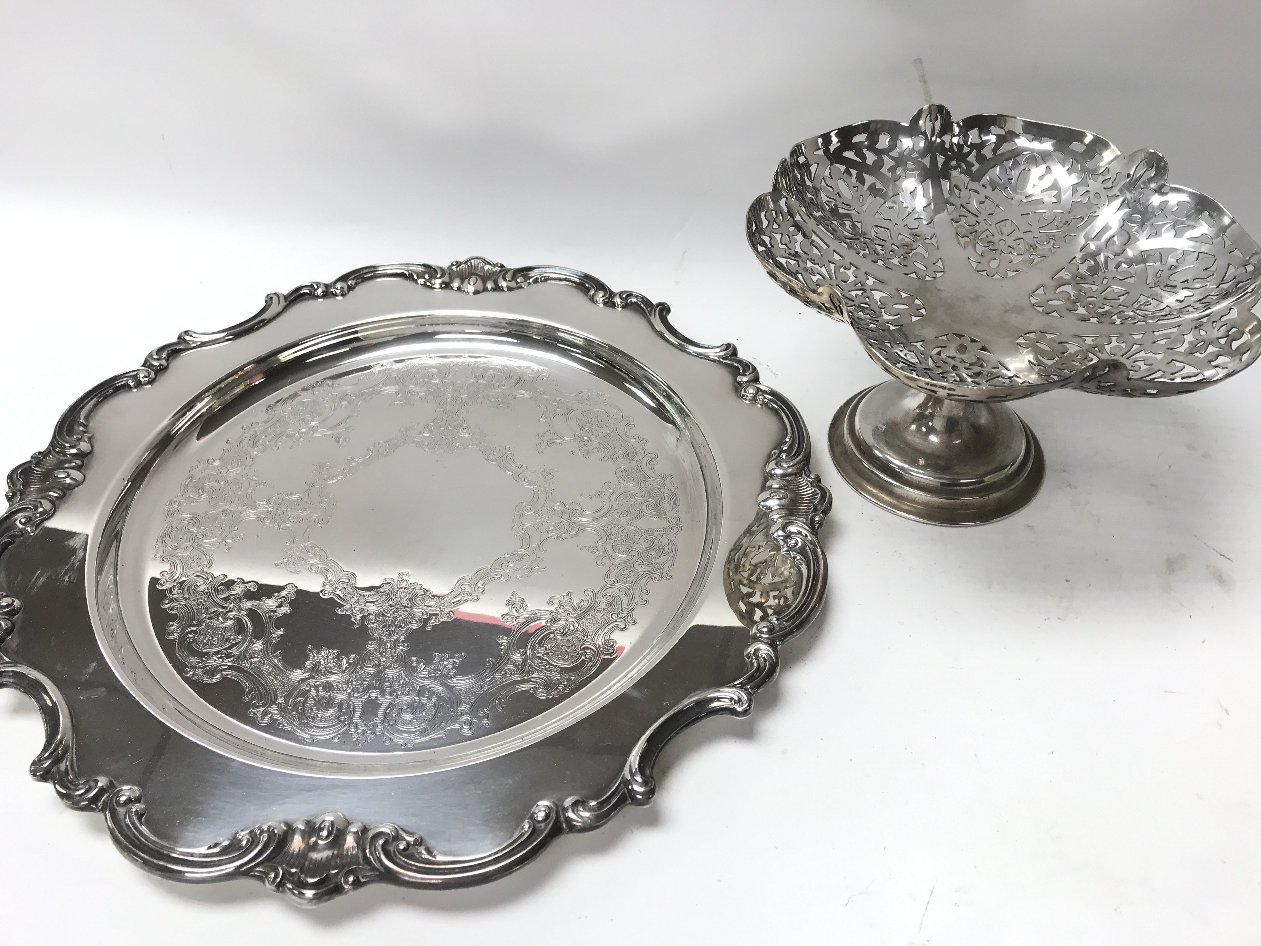 A silver plated tray and a silver plated dish.