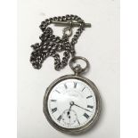 A silver pocket watch with heavy silver chain, cir
