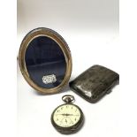 A silver pocket watch, silver cigarette case, a si