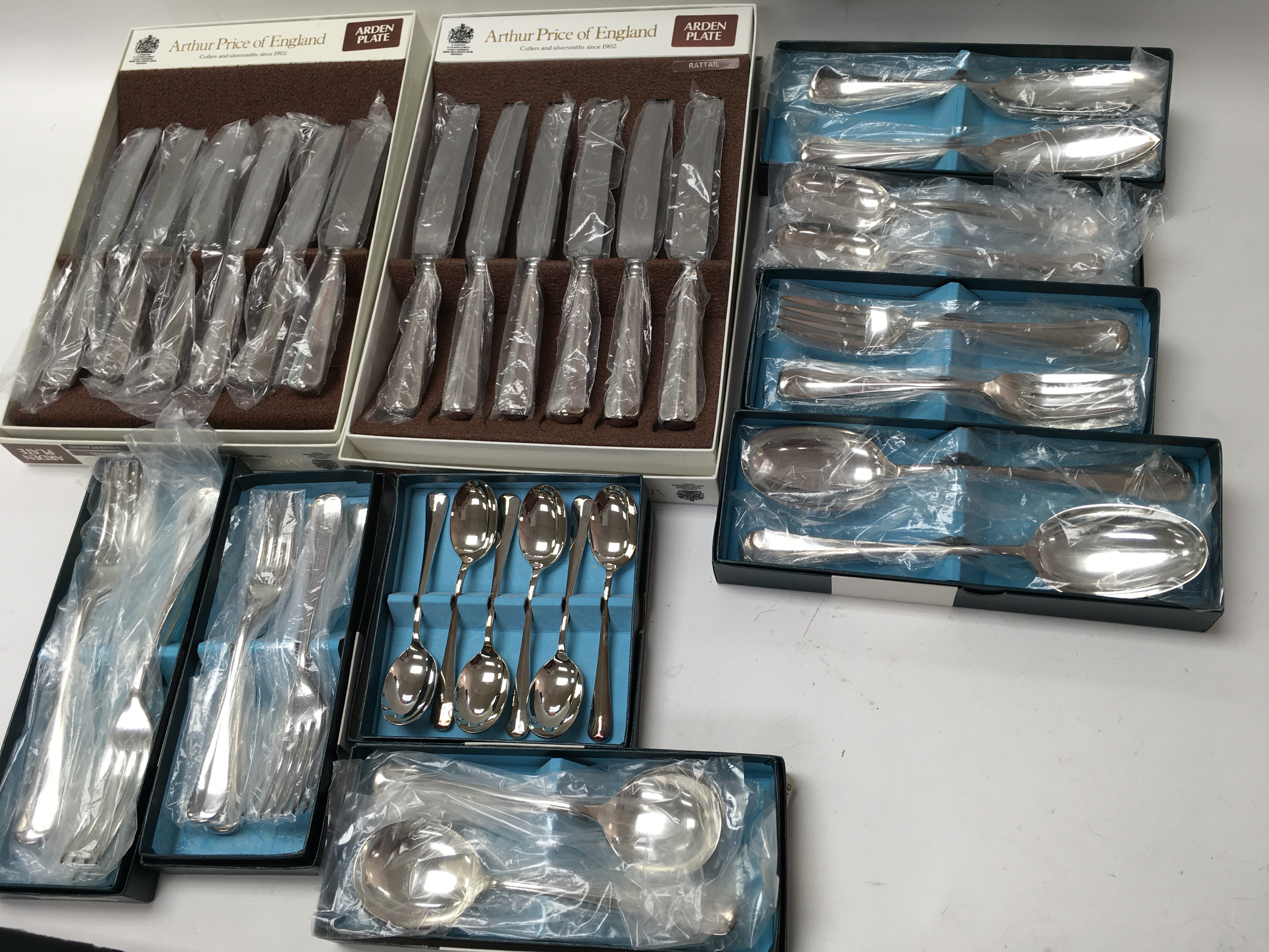 Boxes of unused silver plate cutlery still in orig